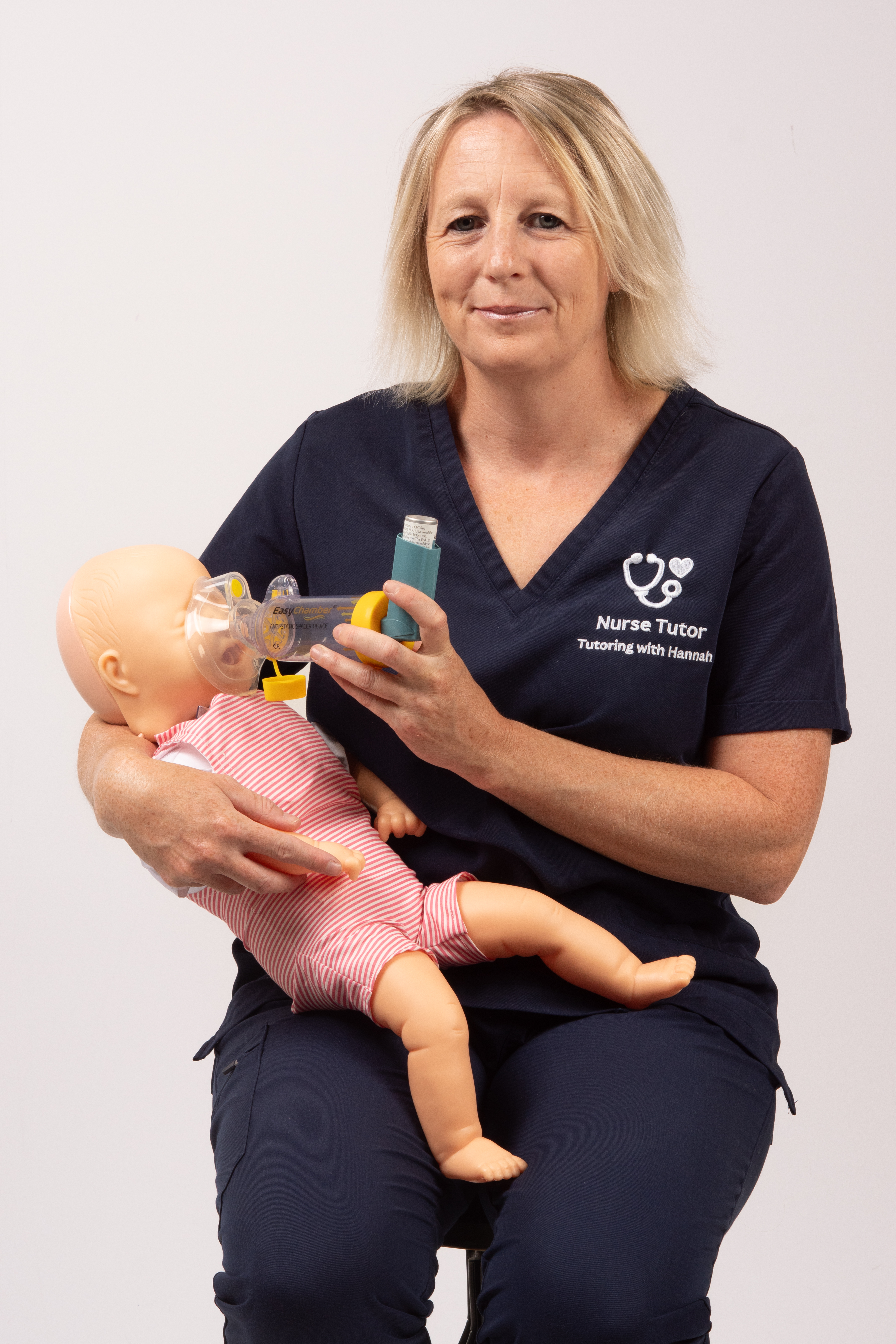 Picture of a nurse with a dummy of a child